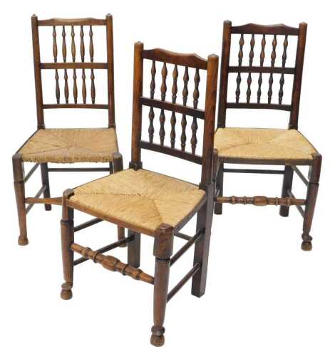 A set of three 19thC Lancashire ash and elm chairs, each with two rows of baluster splats, above...
