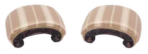 A pair of 19thC heavily carved curved hassocks, upholstered in Regency style material, 16cm high,...