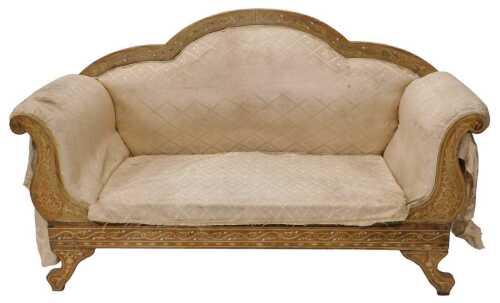 An early 20thC two seater salon sofa, with scroll arms, the frame profusely decorated with...