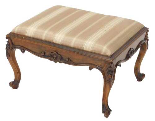 A Victorian walnut framed stool, of rectangular form, with Regency stripe material, heavily...