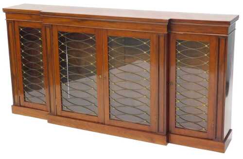 A 19thC mahogany break front side cabinet, centred by two cupboards revealing shelves, flanked...