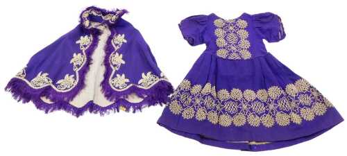 A late 19th/early 20thC child's small size formal dress coat or shawl, raised with floral...