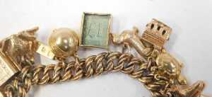 A 9ct gold charm bracelet, the double curb link bracelet with a heart shaped padlock and safety... - 3