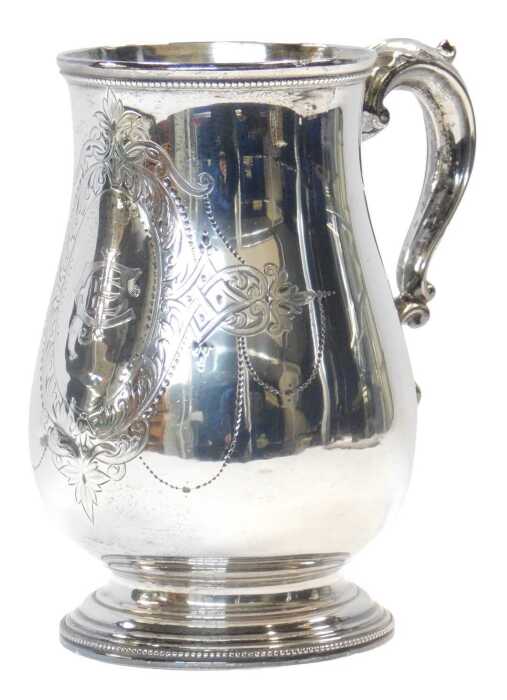 A Victorian silver tankard, of baluster form, with a beaded border and acanthus leaf scrolling...