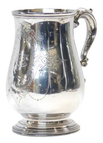 A Victorian silver tankard, of baluster form, with a beaded border and acanthus leaf scrolling...