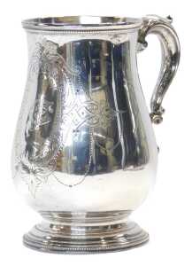 A Victorian silver tankard, of baluster form, with a beaded border and acanthus leaf scrolling...