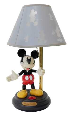 A Mickey Mouse table lamp, the shade decorated with silhouettes of Mickey Mouse, the base...
