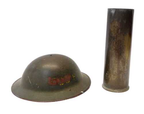 A World War II green-painted Brodie helmet, dated to the interior 1941 and numbered BMBN66,...