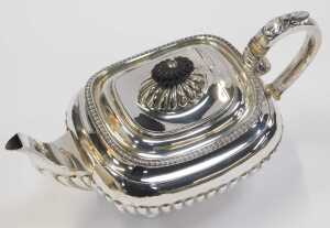 A George V silver teapot, of semi fluted form, raised on four ball feet, with an ebonised knop... - 2