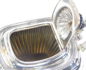 A George V silver teapot, of semi fluted form, raised on four ball feet, with an ebonised knop... - 3