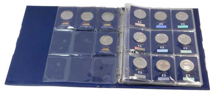 A Change Checker folder, containing thirteen five pound coins, a one pound coin, five fifty...