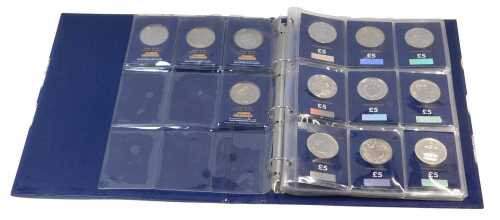 A Change Checker folder, containing thirteen five pound coins, a one pound coin, five fifty...
