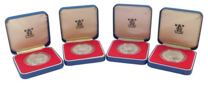 Four Royal Mint Elizabeth II 1977 silver proof commemorative crowns, boxed.