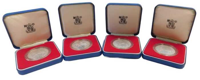 Four Royal Mint Elizabeth II 1977 commemorative silver proof crowns, boxed.