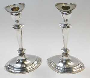 A pair of Edward VII loaded silver candlesticks, of slender tapering form, raised on an oval... - 2