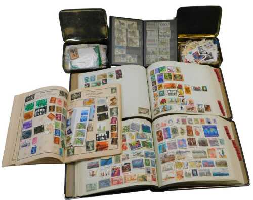20thC postage stamps, GB and world, some loose and others in albums.