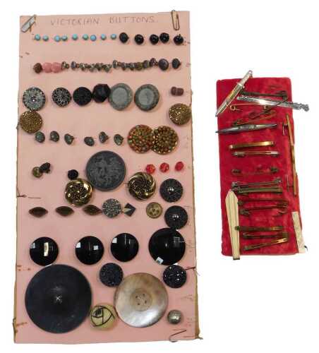 Victorian and later buttons, mounted on a section of pink card, together with various bar...