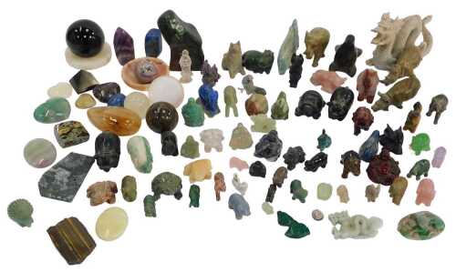 A group of semi precious and other stones, some carved into animals, orbs, etc., stones to...