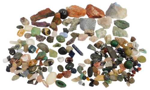 A group of polished, rough cut and other semi precious stones, to include pink quartz, unakite,...