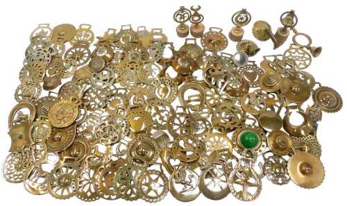 A group of horse brasses and other brass, to include pierced and nautical examples, a brass...