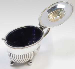 A Victorian silver lidded mustard pot, of semi fluted form, raised on four ball feet, with a... - 2
