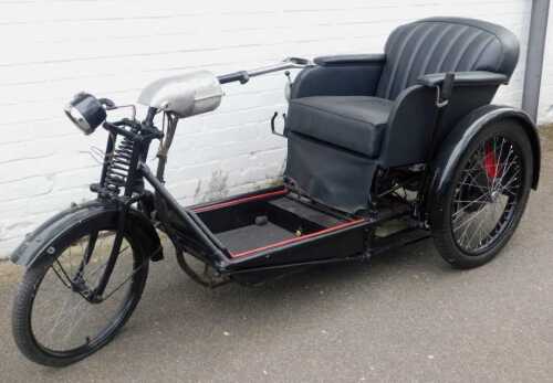 A 1936 Argson Electric three wheeled invalid carriage, registration DBH 889, in black trim with...