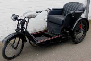 A 1936 Argson Electric three wheeled invalid carriage, registration DBH 889, in black trim with... - 2