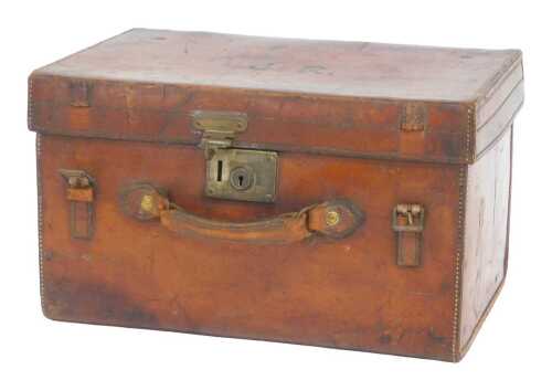 An early 20thC brown leather case, initialled JR, with a red-lined interior bearing label Made...