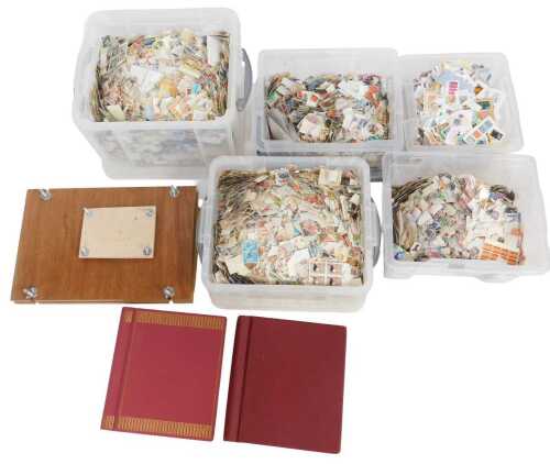 A large collection of GB and world postally used stamps, some in albums, together with a book...