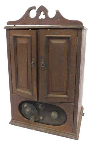 A 1930s BTH oak-cased valve radio, type H, 48cm high. (AF)