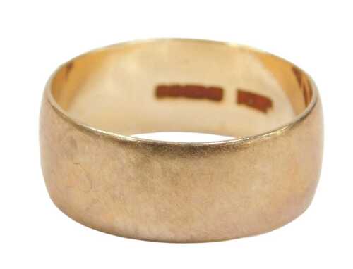 A 9ct gold wedding band, of plain design, 9mm width, Birmingham 1980, 3.3g.