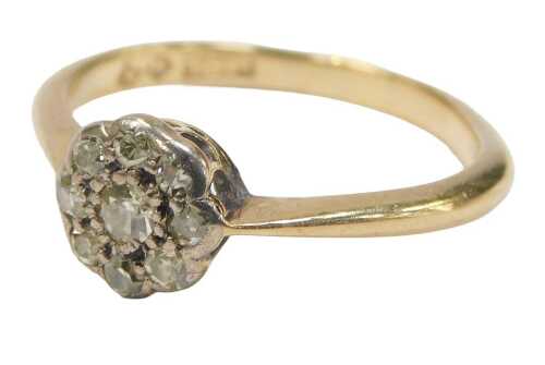 A diamond daisy cluster ring, set with an arrangement of diamonds, the centre stone approx...