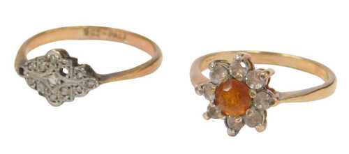 Two dress rings, comprising a floral cluster dress ring set with orange and white paste stones,...