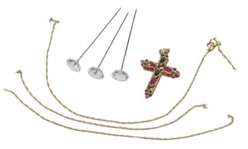 A 9ct gold crucifix pendant and chain, the double-sided crucifix set with sapphires, rubies, and...