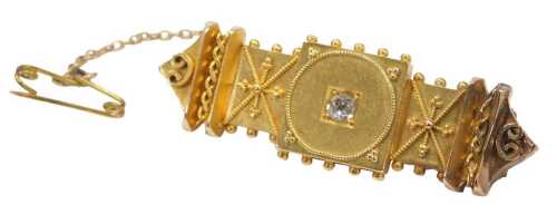 A 19thC Etruscan style diamond set bar brooch, with filigree raised detail and centred by an old...