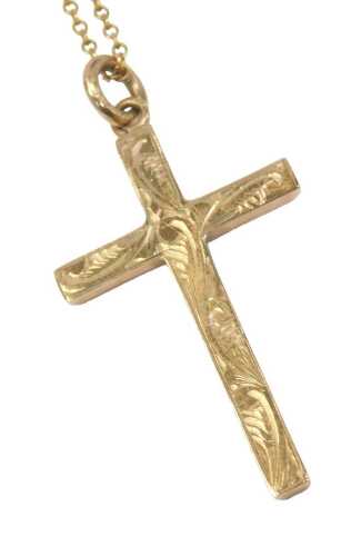 A 9ct gold pendant cross and chain, the cross with scroll engraving, 2.5cm high, on a fine link...