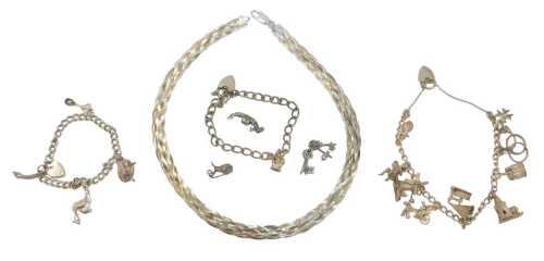 A group of silver and other jewellery, comprising a flattened curb link charm bracelet, with a...