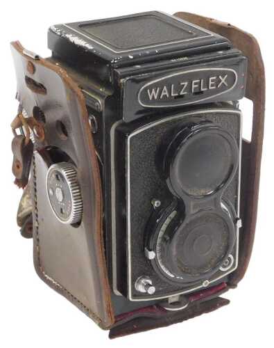 A Walzflex twin reflex camera, number 13635, in a leather case.