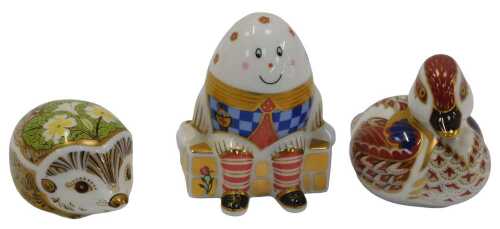 Three Royal Crown Derby porcelain paperweights, modelled as a duckling, Primrose, each with gold...