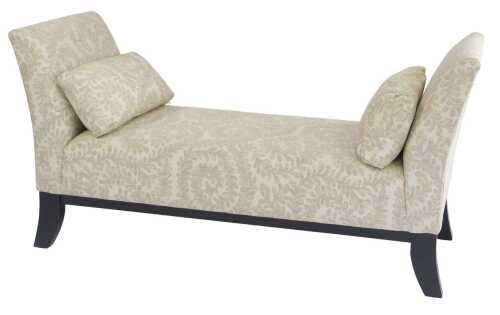 A contemporary window seat, upholstered in pale leaf pattern fabric, with outswept arms, raised...