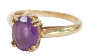 A 9ct gold Gems TV amethyst dress ring, with an oval cut amethyst in a four double claw basket...