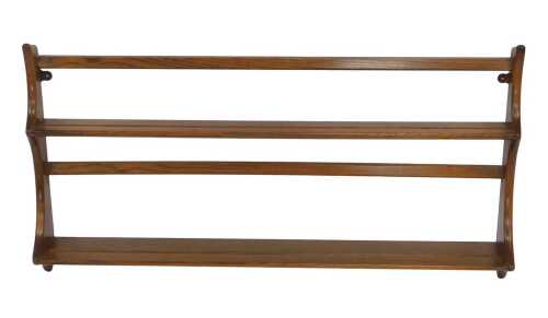 An Ercol elm two shelf wall shelf, 50cm high, 94cm wide, 14cm deep.
