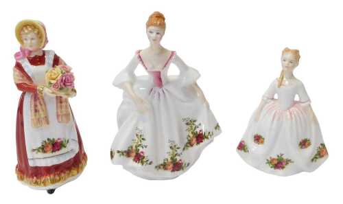 A group of Royal Doulton porcelain figures, comprising Old Country Roses HN3692, Country Rose...