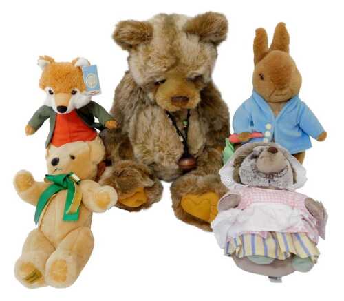 A Charlie Bears multi-tonal brown bear, with suede pads and bell necklace, 50cm high, together...