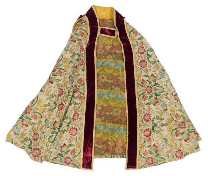 Ecclesiastical interest. A bishop's cope, heavily embroidered with flowers and birds in the...