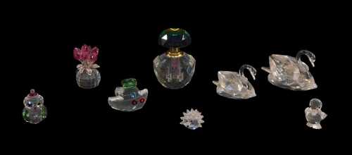 A group of Swarovski crystal and other figures, to include swans, Christmas owl, duckling, etc.,...