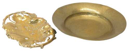 An Indian engraved brass dish, decorated with scrolls, etc., 40cm diameter, and a cast brass two-...