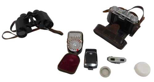 A pair of Carl Zeiss Deltrintem 8x30 binoculars, in a brown leather case initialled THM, and a...