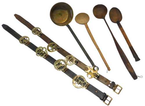 Three carved African tribal wooden spoons, a brass ladle with an iron handle, and two sets of...