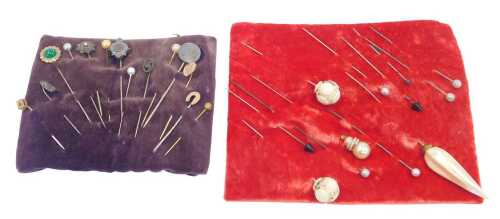 A collection of hat pins, comprising four silver topped hat pins to include horseshoe, floral...